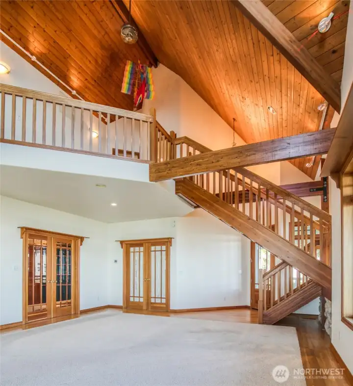 THE HARDWOOD STAIRWAY AND CEILING ARE A FOCAL POINT OF THE LIVING AREA UP TO THE OTHER BEDROOMS!