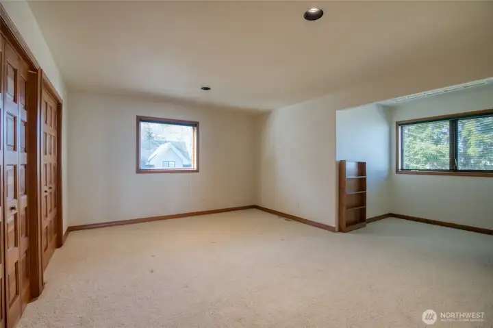 ONE OF TWO GUEST ROOMS.  BEHIND THE BOOKCASES ARE HIDDEN ROOMS FOR STORAGE!