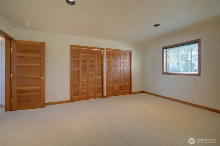 THE BEDROOMS CONTINUE WITH THE HARDWOOD TRIM AND CLOSET DOORS!