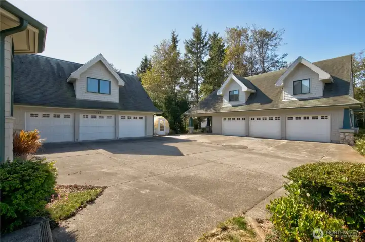 OUTSIDE THERE IS PLENTY OF PARKING AND TWO 3-CAR GARAGES AND A CARPORT!
