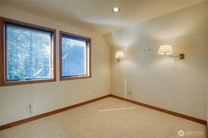 THE ONE BEDROOM APARTMENT HAS A WOODED VIEW OF THE LANDSCAPED YARD BELOW!