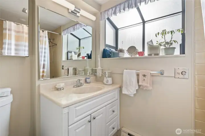 Main floor bathroom, has full tub/shower.