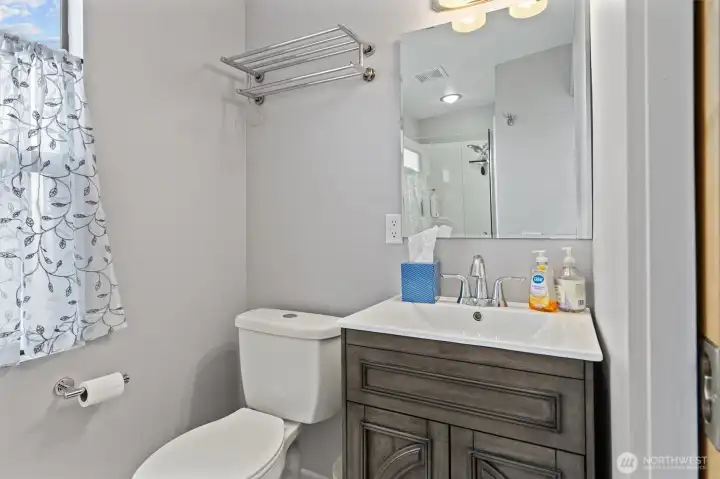 Top floor bathroom with updated shower.