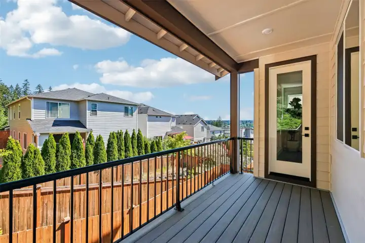 Weather is not a concern enjoying the covered rear yard deck off main level featuring a gas stub for a barbeque grill and relaxing partial Cascade mountain views.