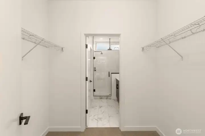 Primary Suite walk-in Closet and en-suite bathroom.