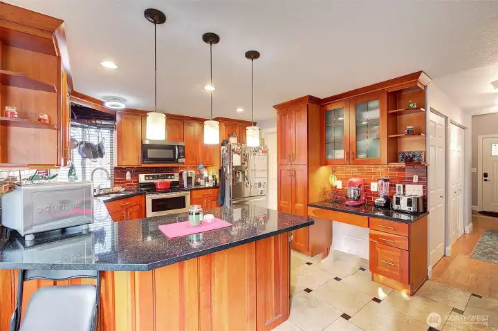 Built in desk in the kitchen and plenty of cabinets