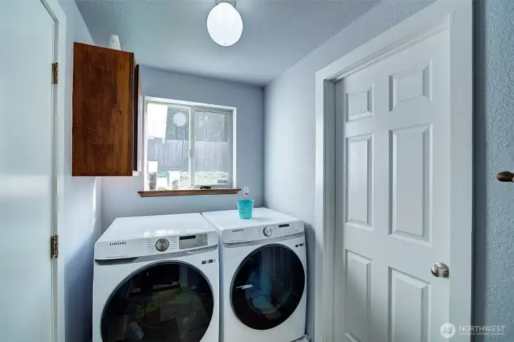 Utility room off the garage; tile floors