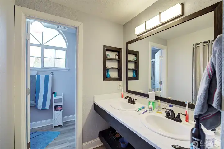 Primary 3/4 Bath with dual sinks and tile floors