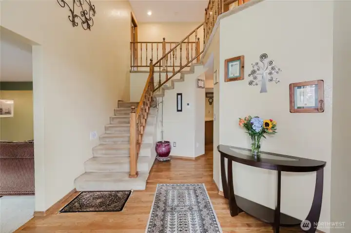 Foyer and stairwell to the second floor.   Hardwood floors on main level.