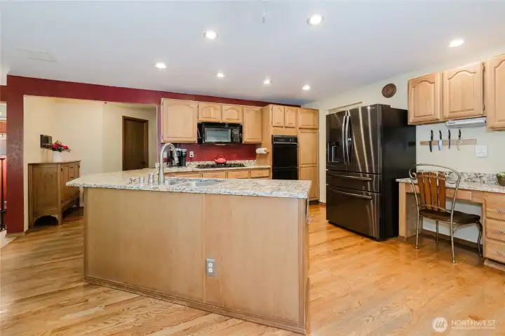 Separate table (message center) to the right of the refrigerator.