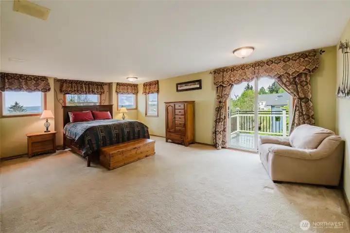 Huge, oversized primary bedroom with recessed wall and sliding door to view deck!