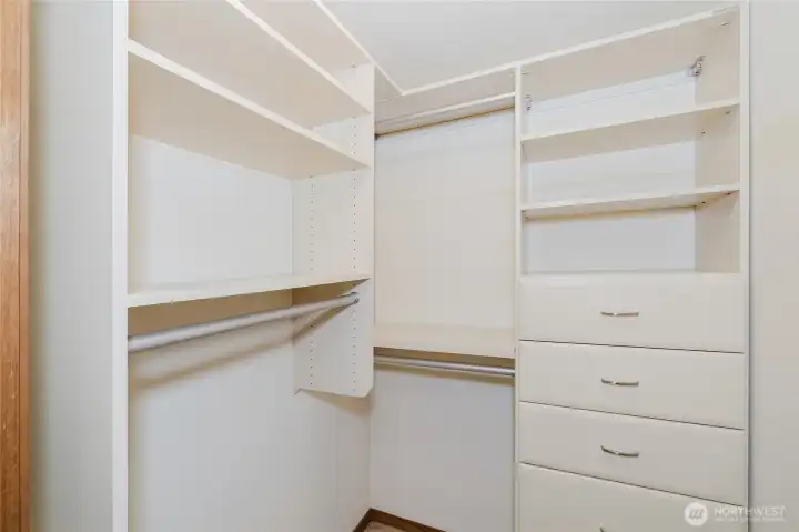 California closet in upper level bedroom.