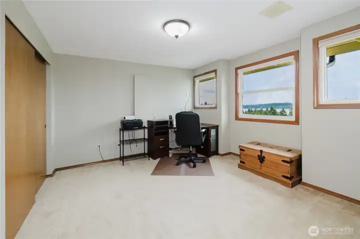 Third bedroom used as an office has built-in ironing board.