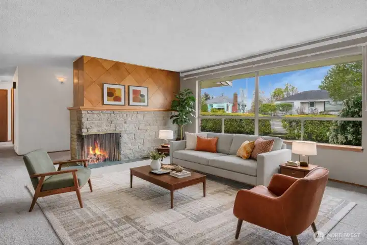 Huge window for tons of natural light, and great wood detail on the brick fireplace. Virtually staged.