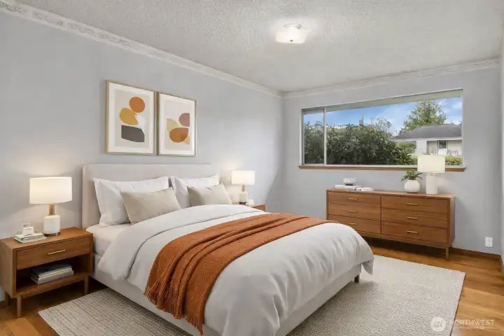 Spacious primary with a large window to allow plenty of natural light, and gorgeous wood floors! Virtually staged.