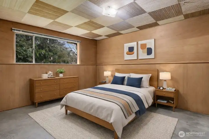 Lower floor bedroom with beautiful wood paneling. Virtually staged.