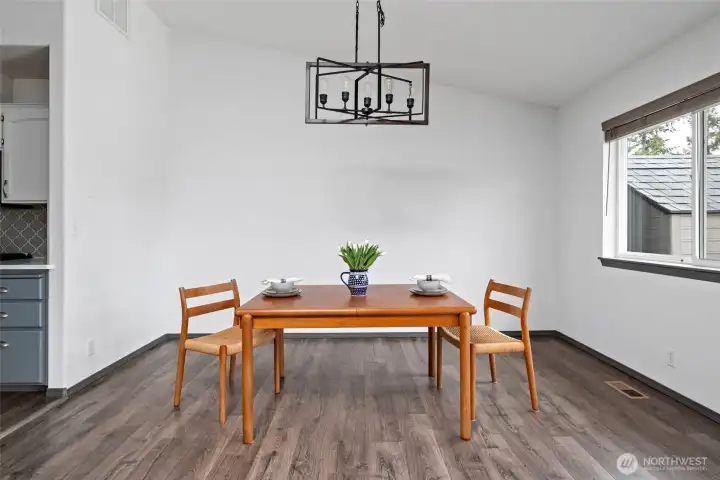 Bring in more chairs there is plenty of space in this dining area.