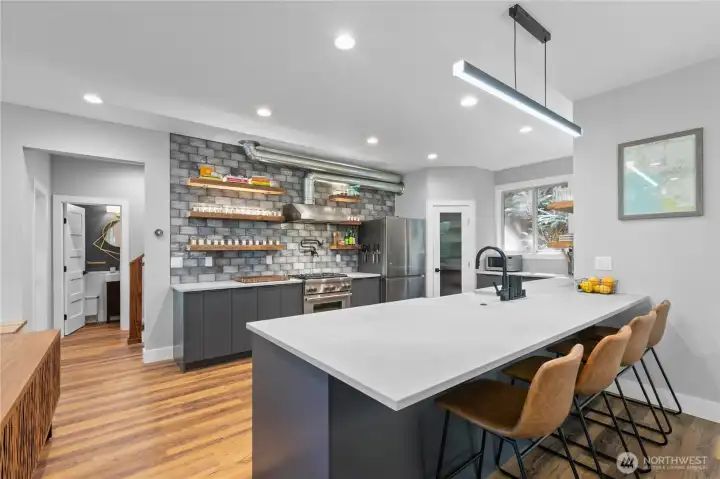 Entertain while preparing a feast in this custom Chef's kitchen.