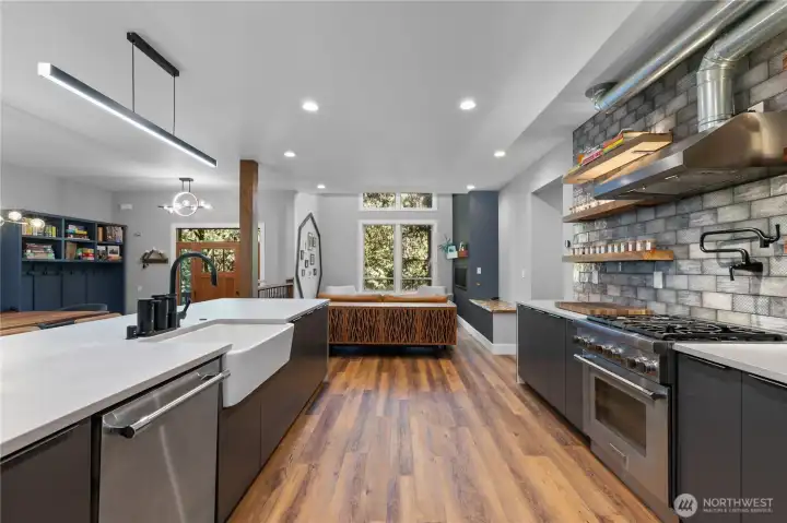 The kitchen features a Thermador gas range and dishwasher.