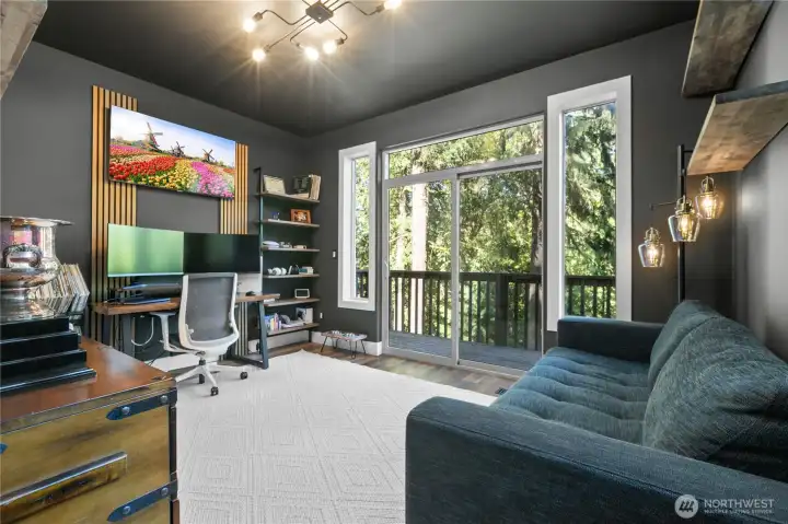 The main level primary bedroom with en suite bathroom.