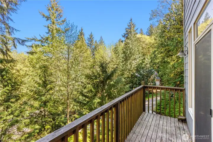 Enjoy the woodland sounds and views from the bedroom deck.