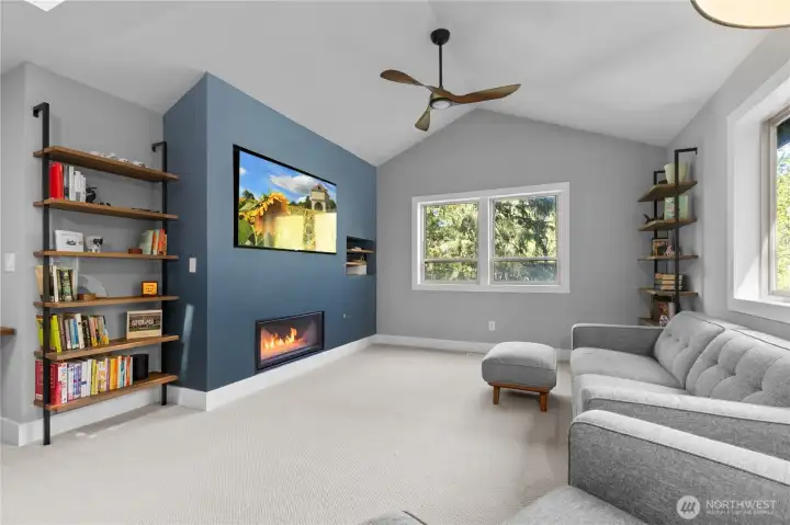 This large family room features vaulted ceilings, a new 4' wide gas fireplace, and new carpet.