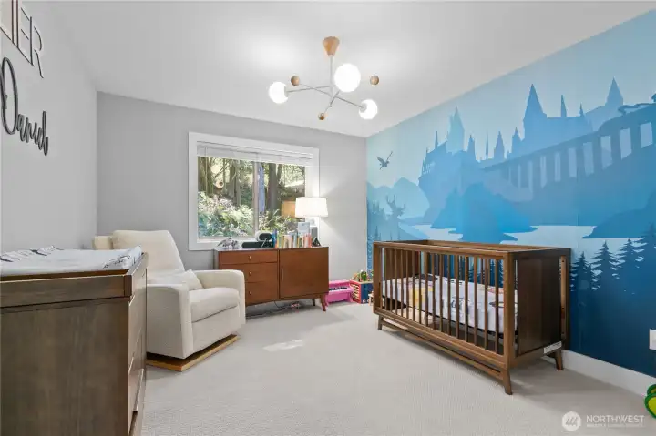 Spacious third bedroom with woodland views.