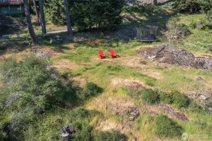 Mossy outcroppings and sunny natural landscape on the adjacent southwest-facing view lot.