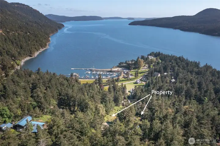 Arrows show 118 Cascade Way along with the adjacent view lot, offered separately to the home purchaser for $355,000. Rosario Harbor marina and beautiful Cascade Bay are shown in the background.
