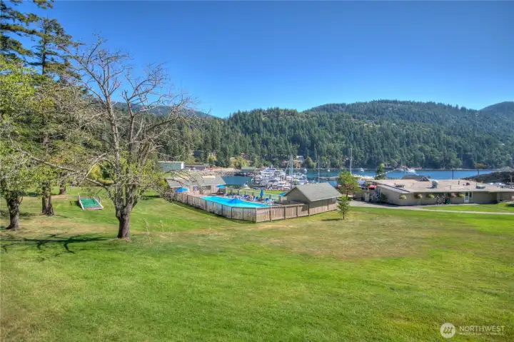 Seasonal Rosario Harbor amenities include moorage, heated outdoor pool, dock day use, Harbor Bar & Grill, showers, bathrooms, mooring buoys, and safe anchorage — all just moments from 118 Cascade Way.