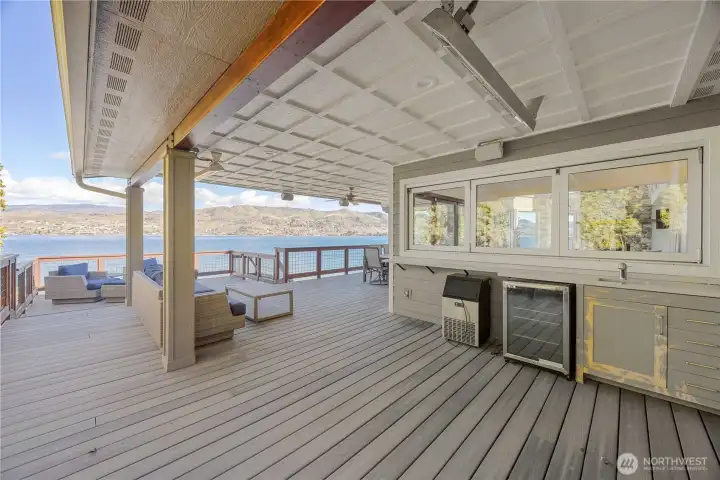 Outdoor entertaining with heaters, speakers, sink and wine fridge. The covered deck helps with shade on hot Chelan afternoons