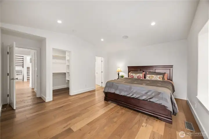 Main floor Primary suite with french doors to the Lakeside deck.