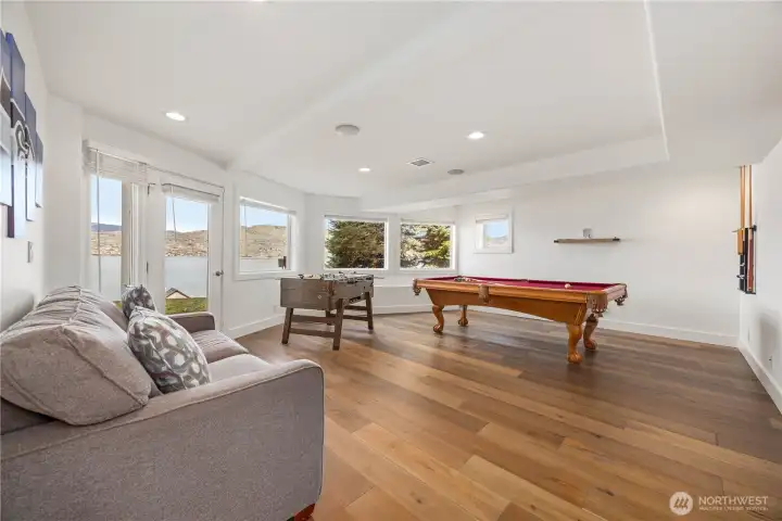 Lower level rec room opens to the lawn leading down to the Lake.