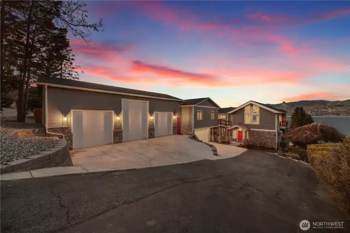 Twilight at Lake Chelan—warm lighting, serene setting, and a home that blends luxury, privacy, and year-round beauty.