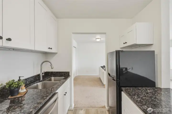 Updated kitchen includes granite countertops, new cabinets with soft-close doors and drawers, and new dishwasher Updated kitchen includes granite countertops, new cabinets with soft-close doors and drawers, and new dishwasher