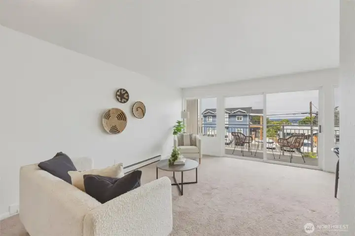 Living room flows seamlessly into the covered balcony for easy indoor/outdoor living Living room flows seamlessly into the covered balcony for easy indoor/outdoor living