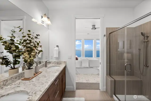 Indulge in luxury in the primary spa-like bathroom, featuring a generously sized walk-in shower and a double vanity, creating your own personal sanctuary.