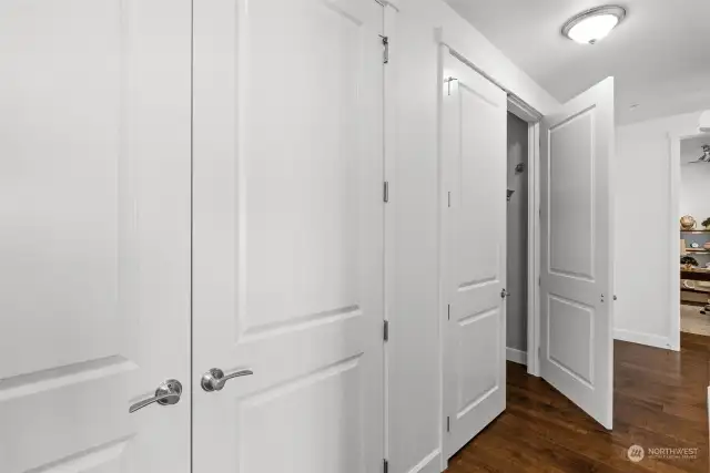 A shot of the hallway with double closets for even more storage.