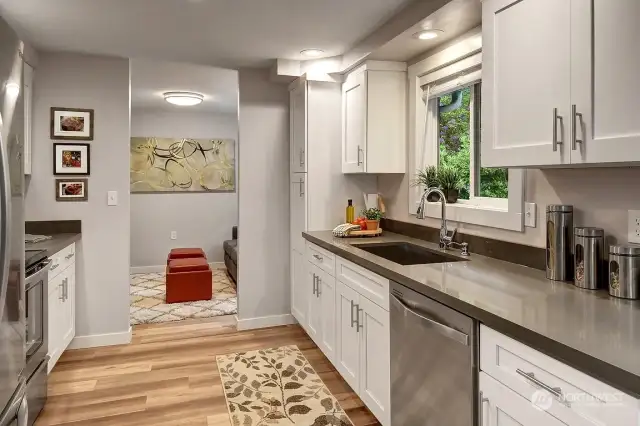 Looking through the kitchen to additional seating area.