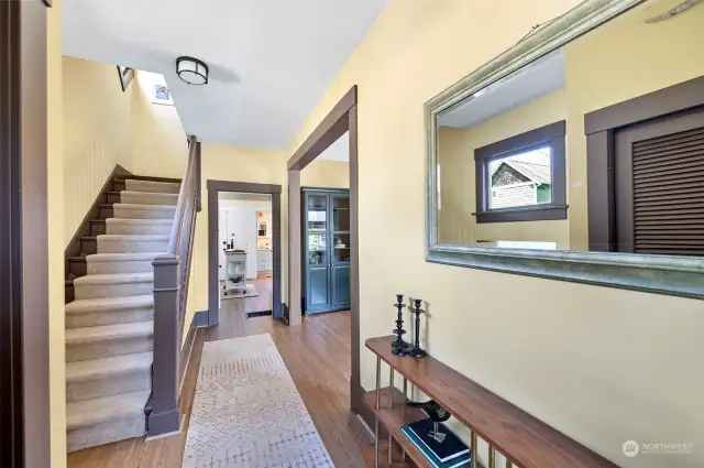 Immediately upon entering, you will notice the soaring ceilings and grand staircase.