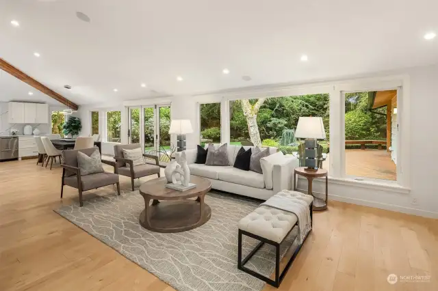 Wall of windows showcase the fabulous private back yard.