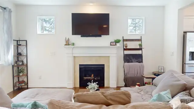 A gas fireplace in the living room warms the space