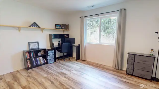 The fourth of four bedrooms, looking onto the backyard
