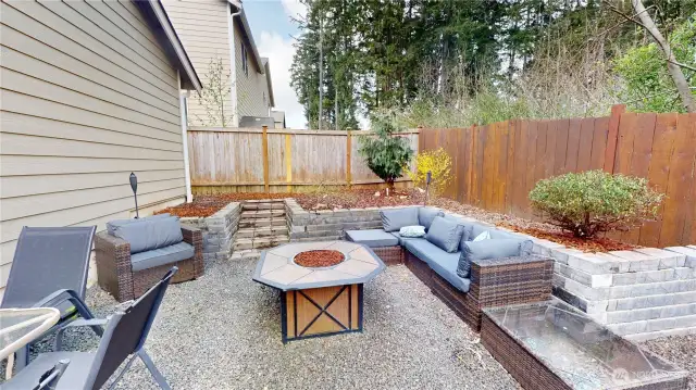 Dedicated fire pit space with gravel