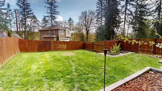 Spacious side yard is completely fenced