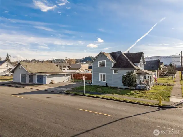 Side View from 7th Ave – Home with Generous Off-Street Parking and Detached Shop