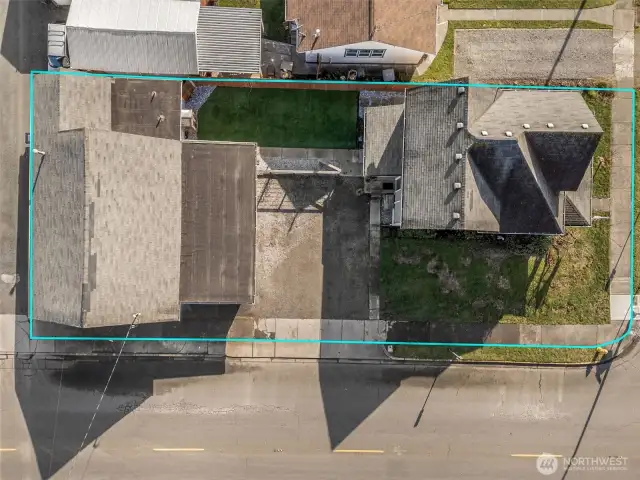 Aerial View – Corner Lot with Home, Shop, and Expansive Wrap-Around Yard