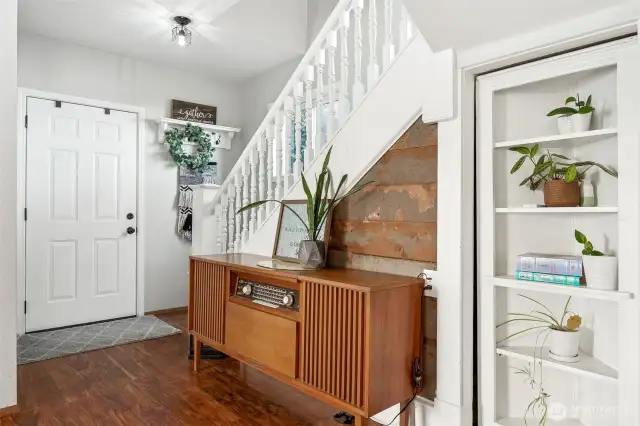 Storybook Entry with Bookcase Door to Hidden Storage Beneath the Stairs