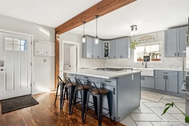 Stylish Kitchen Featuring Exposed Wood Beam and Easy Access from Private Drive