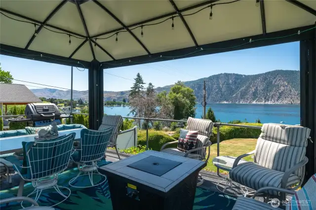 Private patio features a charming covered gazebo. Soak in panoramic views of Lake Chelan, Manson Bay, and the majestic North Cascades. The ultimate vantage point for fireworks, boat races, and year-round scenic beauty.